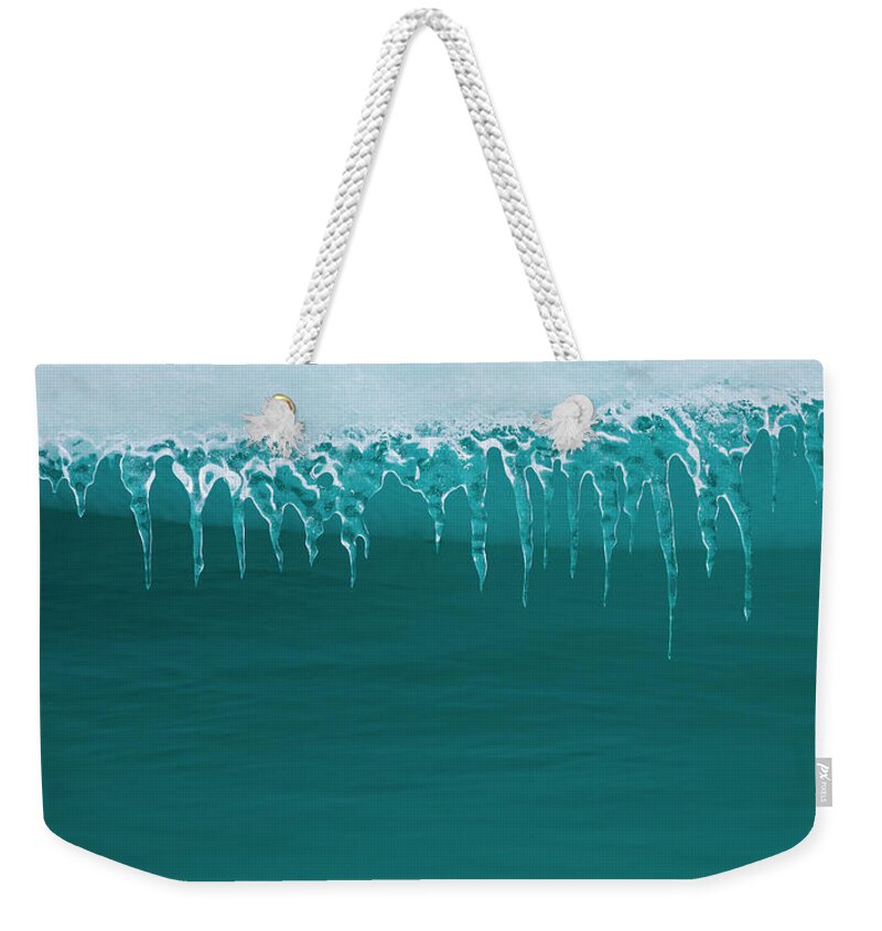 Melting Weekender Tote Bag featuring the photograph Icicles Hanging From An Iceberg #1 by Mint Images/ Art Wolfe