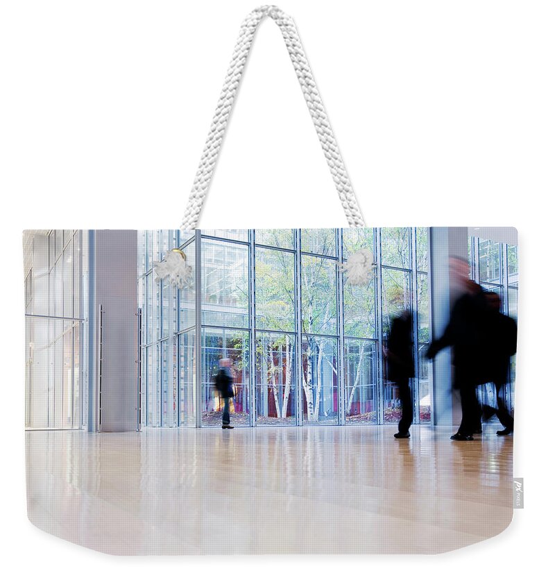 Pedestrian Weekender Tote Bag featuring the photograph Office Building #1 by Nikada