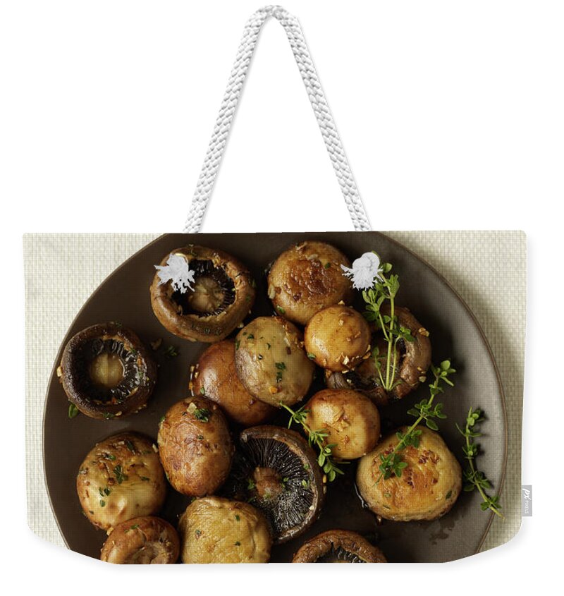 Edible Mushroom Weekender Tote Bag featuring the photograph Roasted Mushrooms With Thyme #1 by James Baigrie