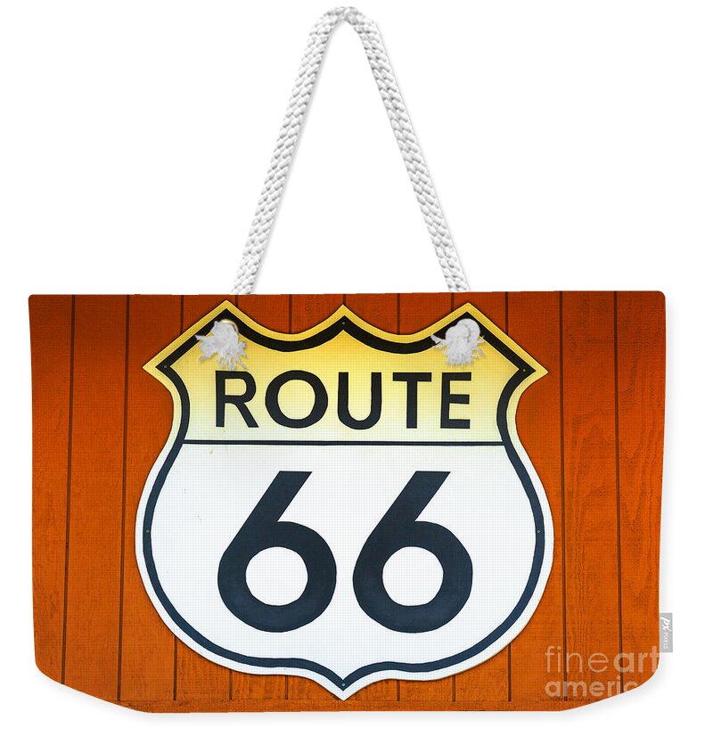 Route 66 Weekender Tote Bag featuring the photograph Route 66 wooden background #1 by Benny Marty
