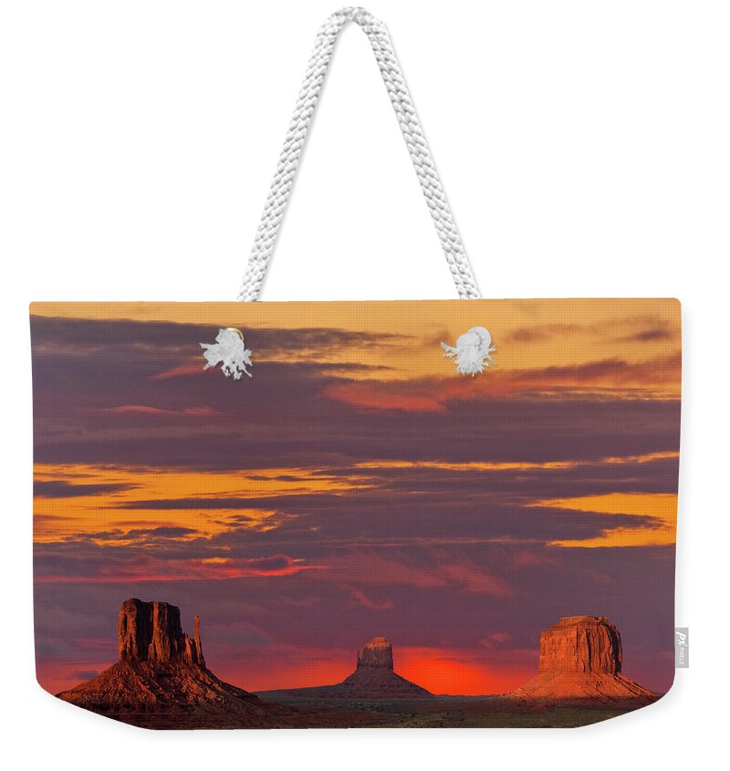 Arid Climate Weekender Tote Bag featuring the photograph The Mittens and Merrick Butte at Sunset by Jeff Goulden