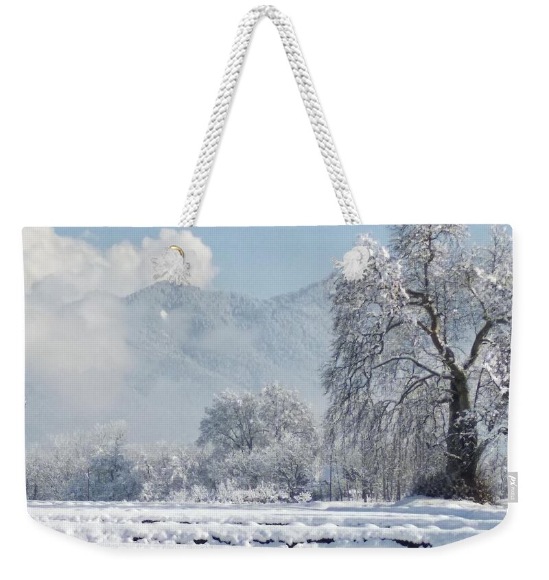  Weekender Tote Bag featuring the photograph The Snow Story by Jacob