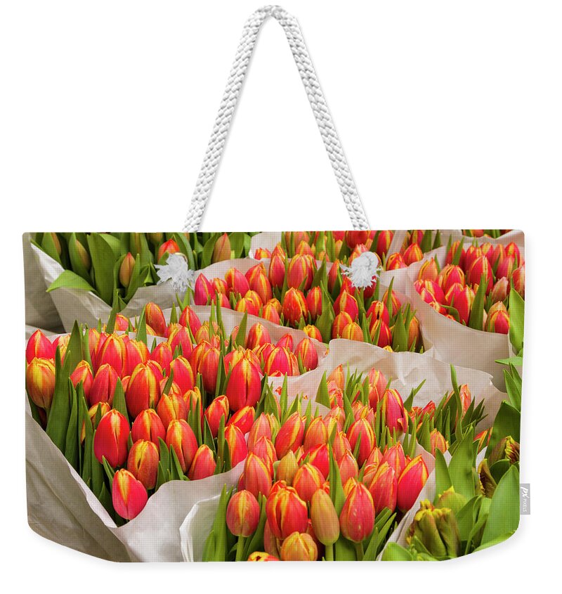 North Holland Weekender Tote Bag featuring the photograph Tulips For Sale At A Flower Market #1 by P A Thompson