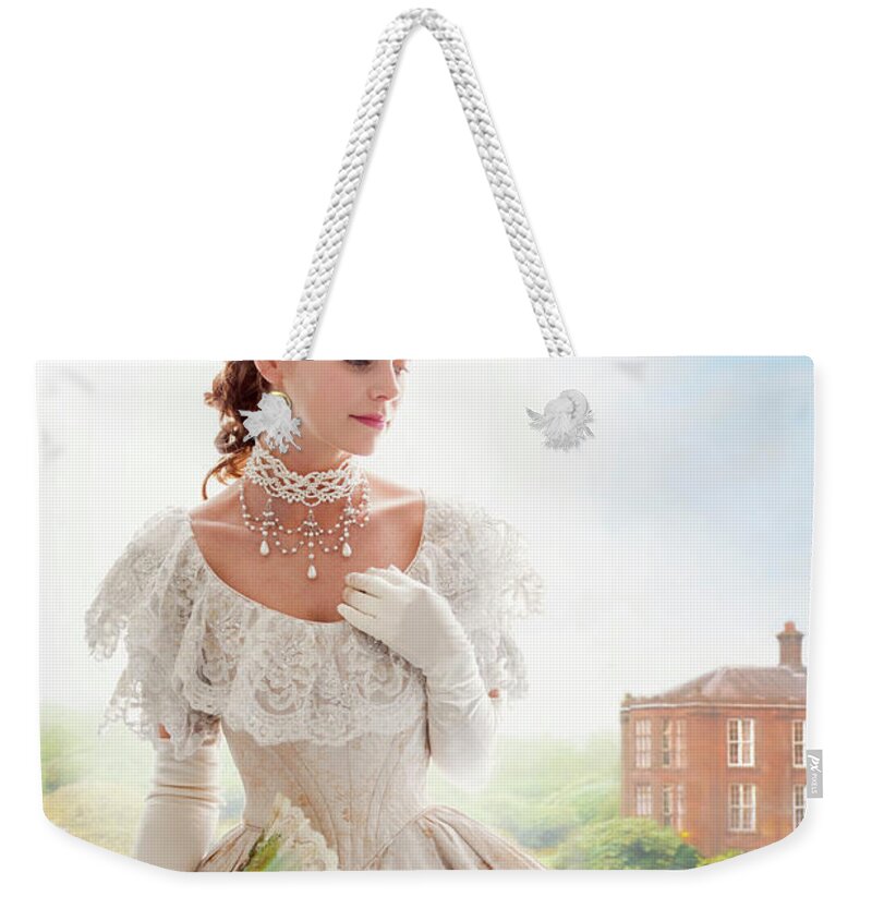 Victorian Weekender Tote Bag featuring the photograph Victorian Woman In The Grounds Of A Mansion House #1 by Lee Avison