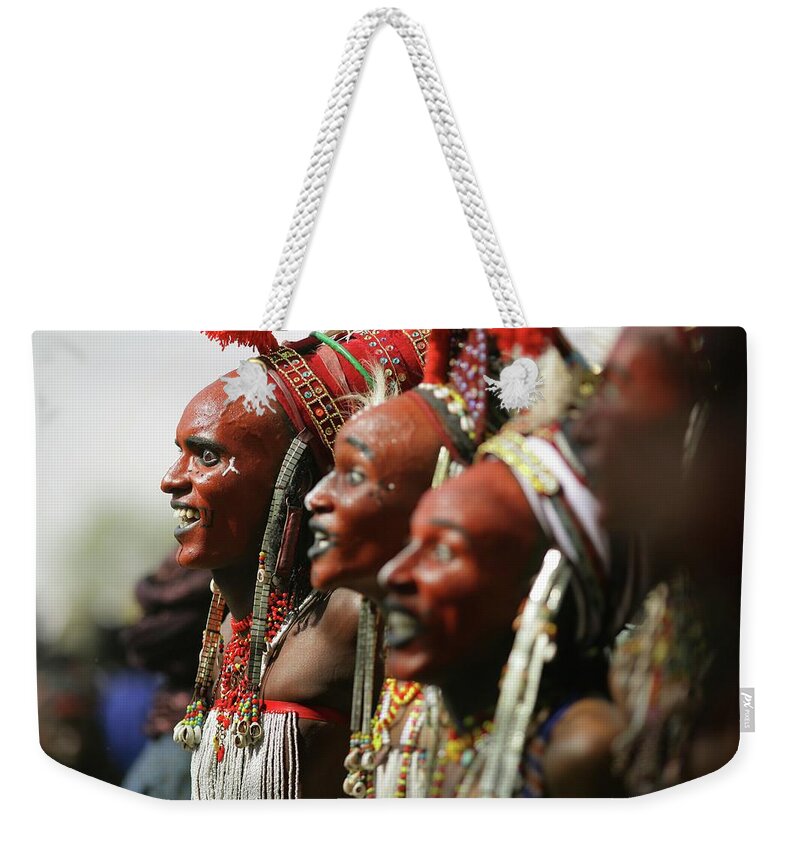 Headwear Weekender Tote Bag featuring the photograph Wodaabe Tribe Gerewol Courtship Ritual #1 by Timothy Allen