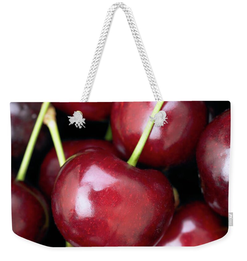 Cherry Weekender Tote Bag featuring the photograph Cherries #2 by Maria Toutoudaki