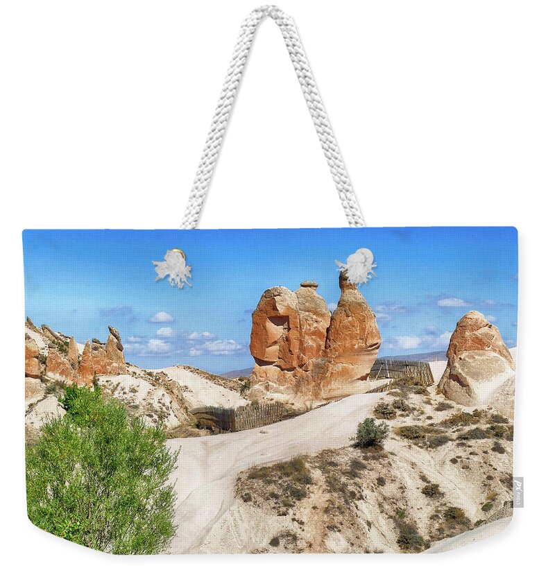 Volcanic Weekender Tote Bag featuring the photograph Fairy chimney balanced rock formations #2 by Steve Estvanik