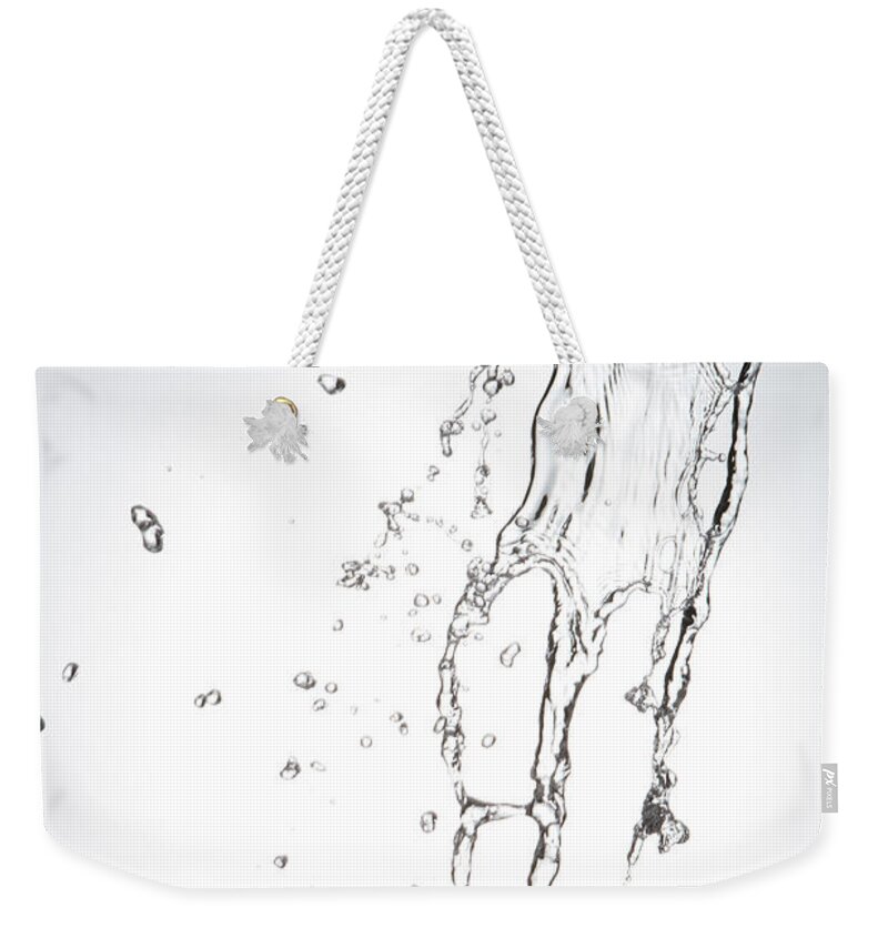 Spray Weekender Tote Bag featuring the photograph Pouring Water #2 by Blackred