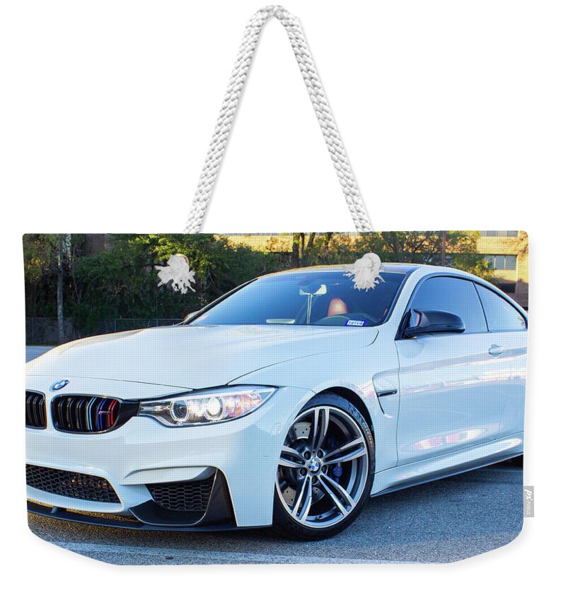 Bmw M4 Weekender Tote Bag featuring the photograph Bmw M4 by Rocco Silvestri