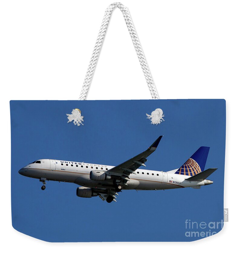 Airplane Weekender Tote Bag featuring the photograph on approach to San Francisco International Airport #34 by Jason O Watson