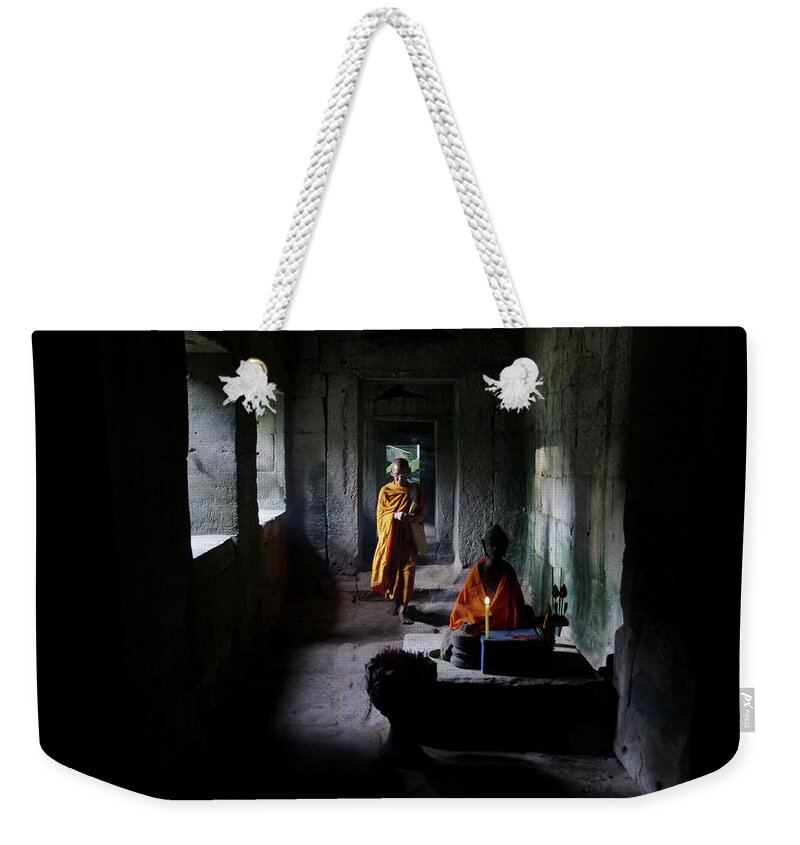 Young Men Weekender Tote Bag featuring the photograph Buddhist Monk At Angkor Wat Temple #4 by Timothy Allen
