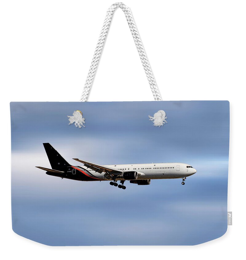 Titan Weekender Tote Bag featuring the mixed media Titan Airways Boeing 767-36N by Smart Aviation