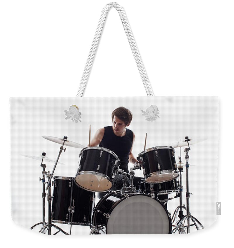 Cool Attitude Weekender Tote Bag featuring the photograph A Man On Drums Performing, Studio Shot by Antenna