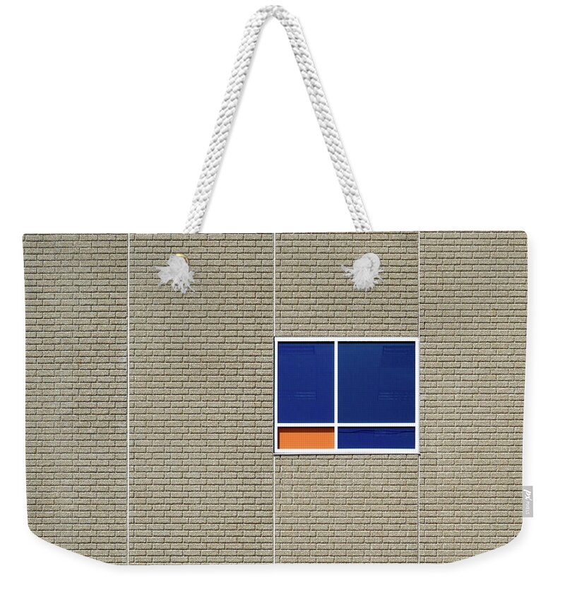 Urban Weekender Tote Bag featuring the photograph A Splash of Orange by Stuart Allen