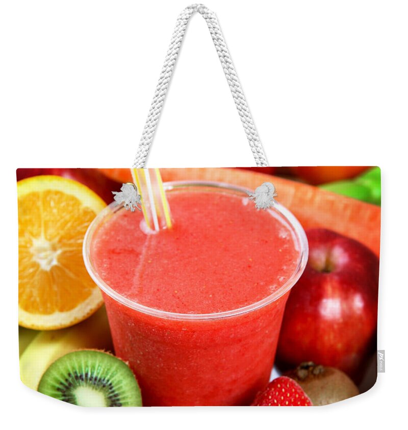 Cool Attitude Weekender Tote Bag featuring the photograph A Strawberry Smoothie Surrounded By by Whitewish