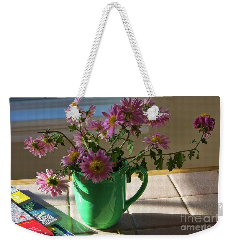 Still Life Weekender Tote Bag featuring the photograph A traveler still life with autumn flowers by Tatiana Travelways