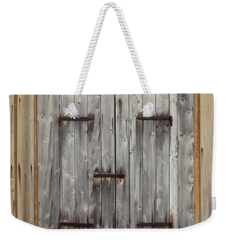 Gotland Weekender Tote Bag featuring the photograph A Wooden Door by Benne Ochs