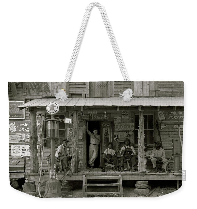 African Weekender Tote Bag featuring the painting African American and a white store owner on the Porch of a country store by 