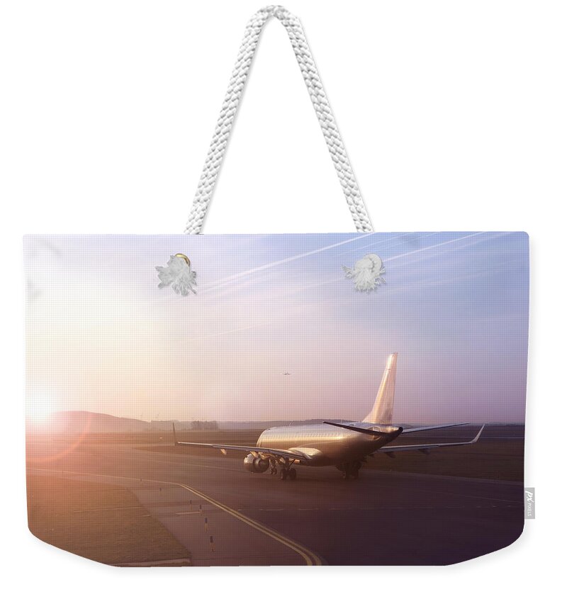 Taking Off Weekender Tote Bag featuring the photograph Airplane On Runway Ready To Take Off by Narvikk