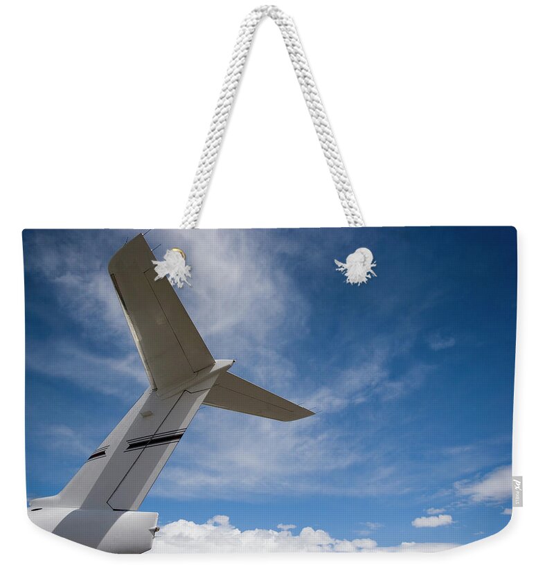 Airplane Weekender Tote Bag featuring the photograph Airplane Tail & Blue Sky-1 by Sierrarat