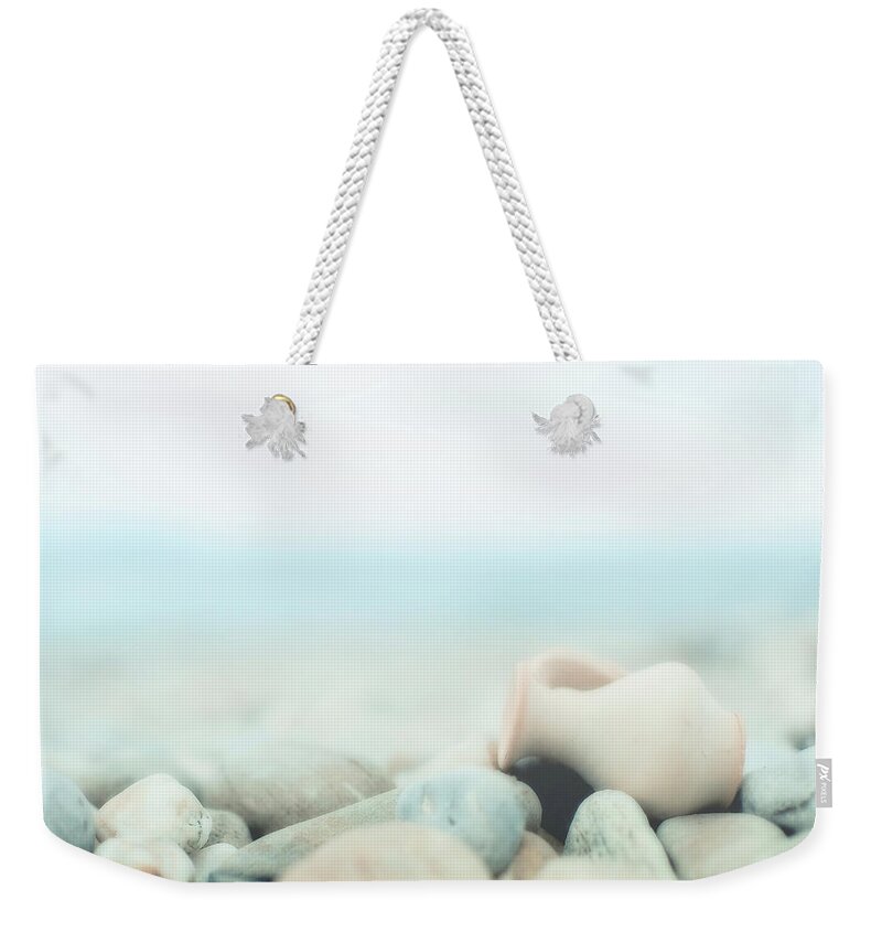 Vase Weekender Tote Bag featuring the photograph Amphora Lies On Pebbles by Alexandre Fp
