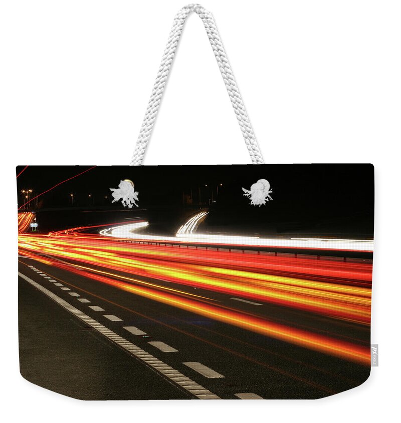 Long Weekender Tote Bag featuring the photograph An Image Of A Object Moving Faster Than by Alfsky
