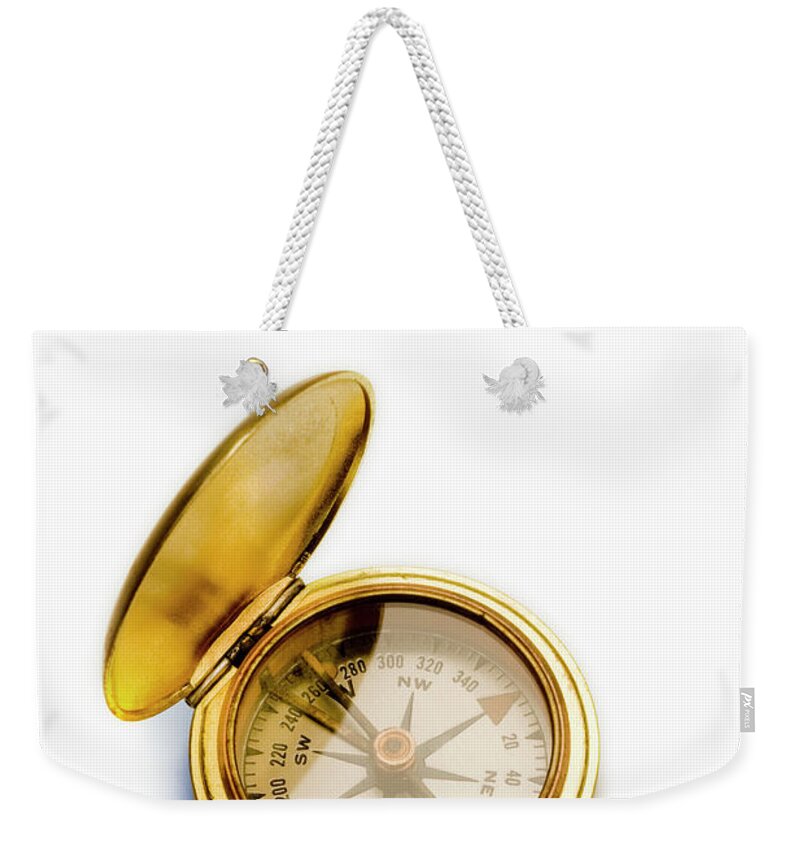 White Background Weekender Tote Bag featuring the photograph Antique Brass Compass Against White by Gary S Chapman