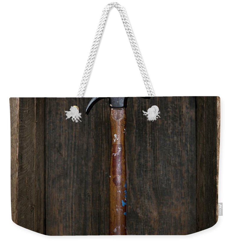 Toughness Weekender Tote Bag featuring the photograph Antique Hammer Floating In Old Box by Chris Parsons