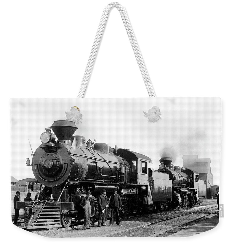 People Weekender Tote Bag featuring the photograph Antique Steam Engine by Jupiterimages