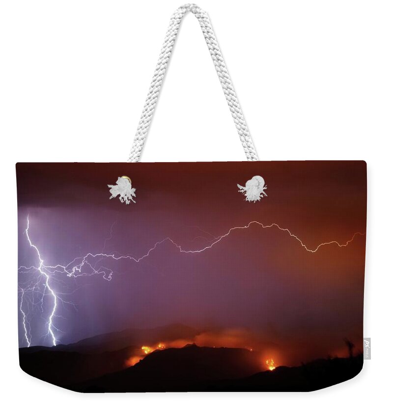 Tranquility Weekender Tote Bag featuring the photograph Armaggedon Lightning Strikes Near A by Nic Leister