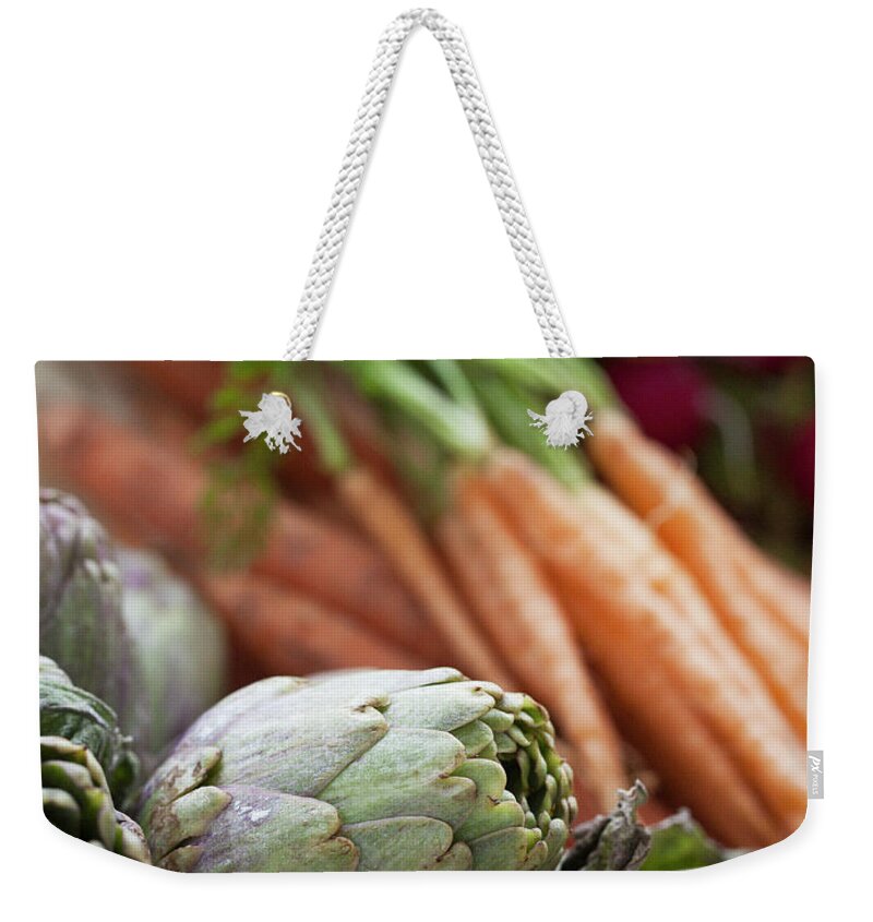 Sweden Weekender Tote Bag featuring the photograph Artichokes And Carrots by Johner Images