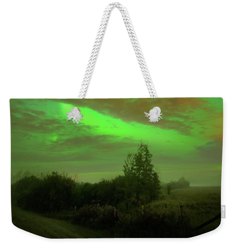 Northern Lights Weekender Tote Bag featuring the photograph Autumn Aurora by Dan Jurak