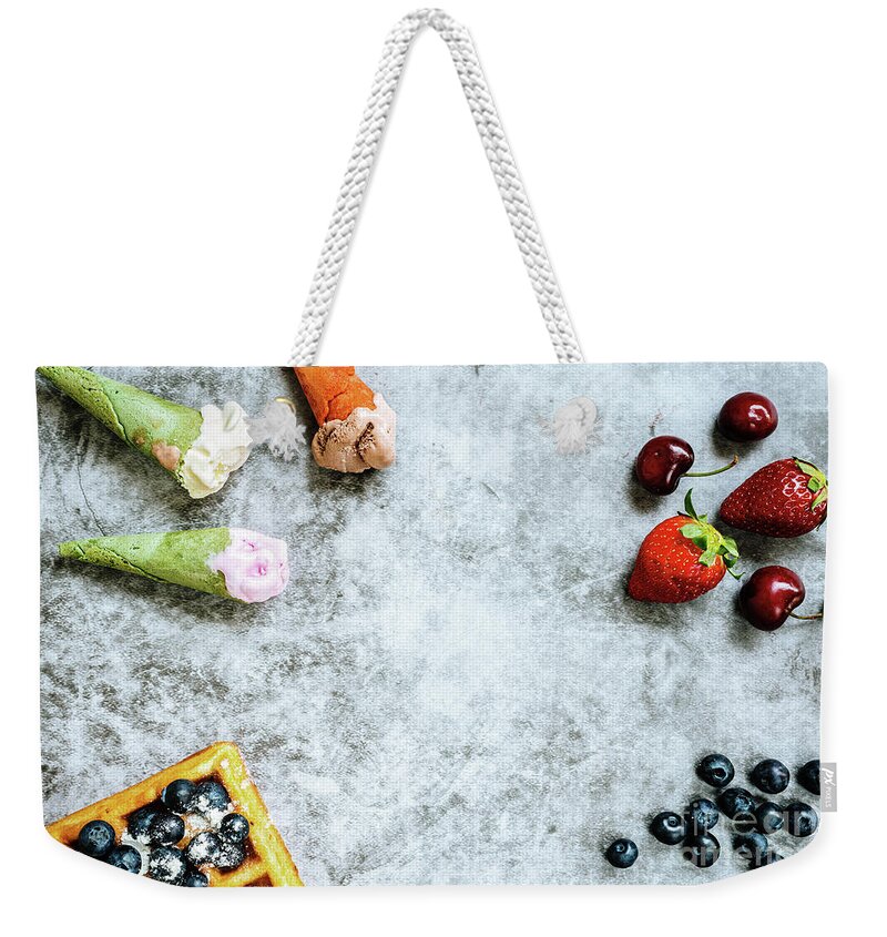 Above Weekender Tote Bag featuring the photograph Background of tasty and sweet foods with red fruits and waffles, by Joaquin Corbalan