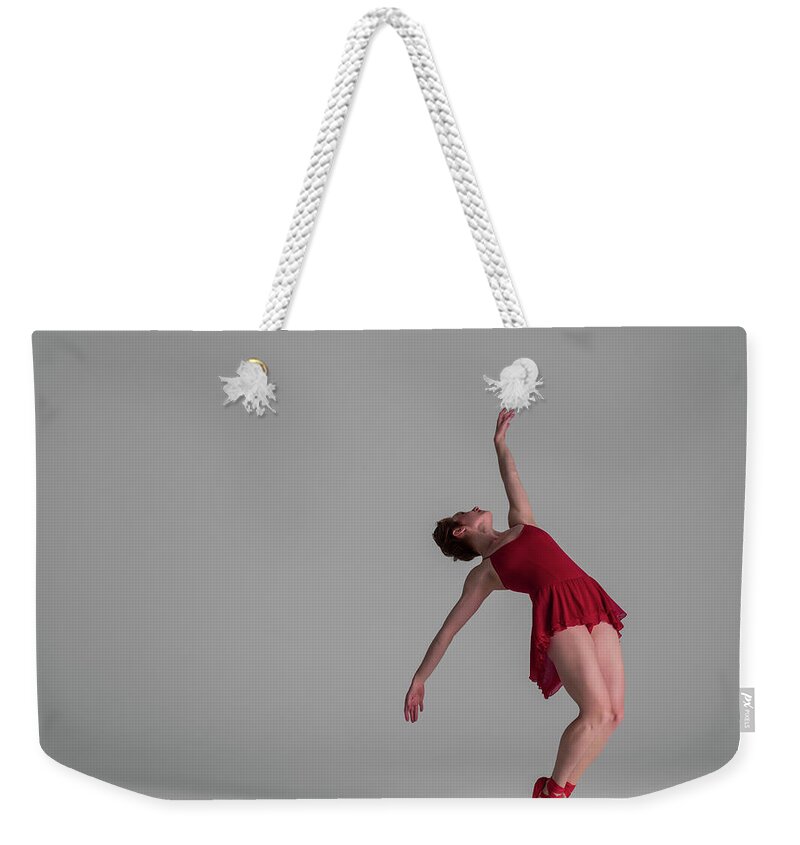 Ballet Dancer Weekender Tote Bag featuring the photograph Ballerina Balancing On Point by Nisian Hughes