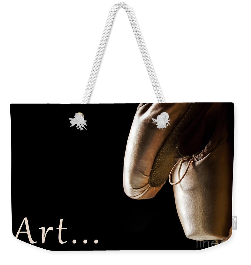 Ballet Weekender Tote Bag featuring the photograph Ballet pointe shoes hanging over black background. by Jelena Jovanovic