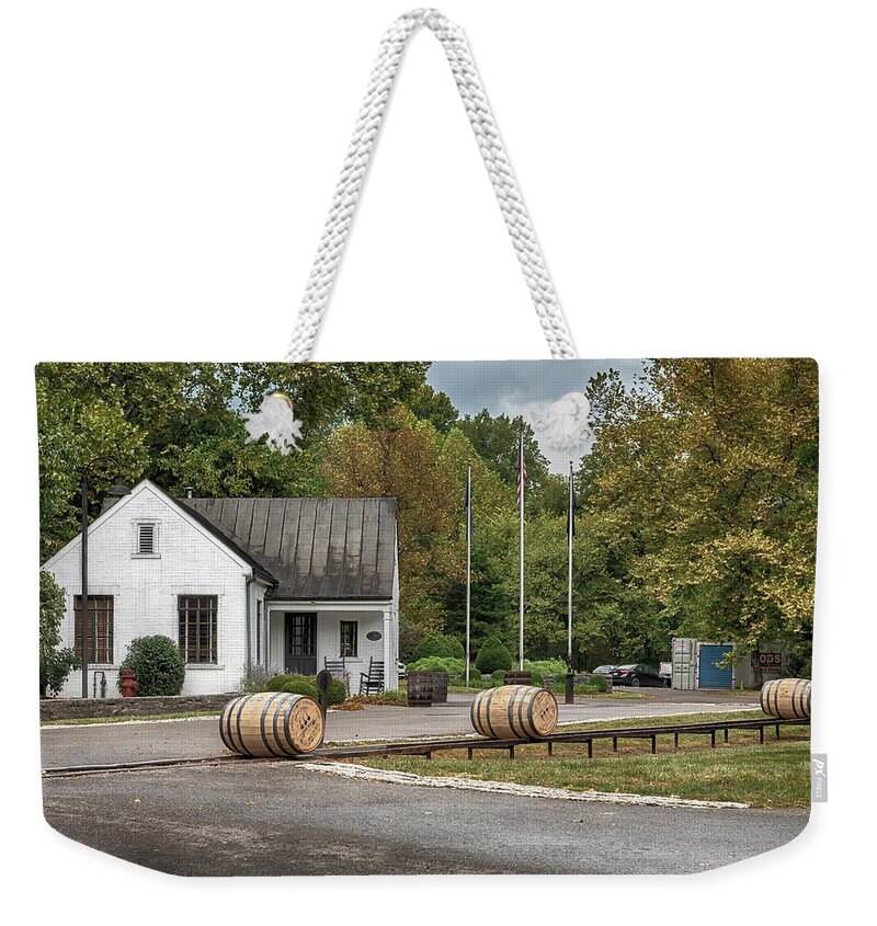 Woodford Reserve Weekender Tote Bag featuring the photograph Barrel Rolling at Woodford Reserve by Susan Rissi Tregoning