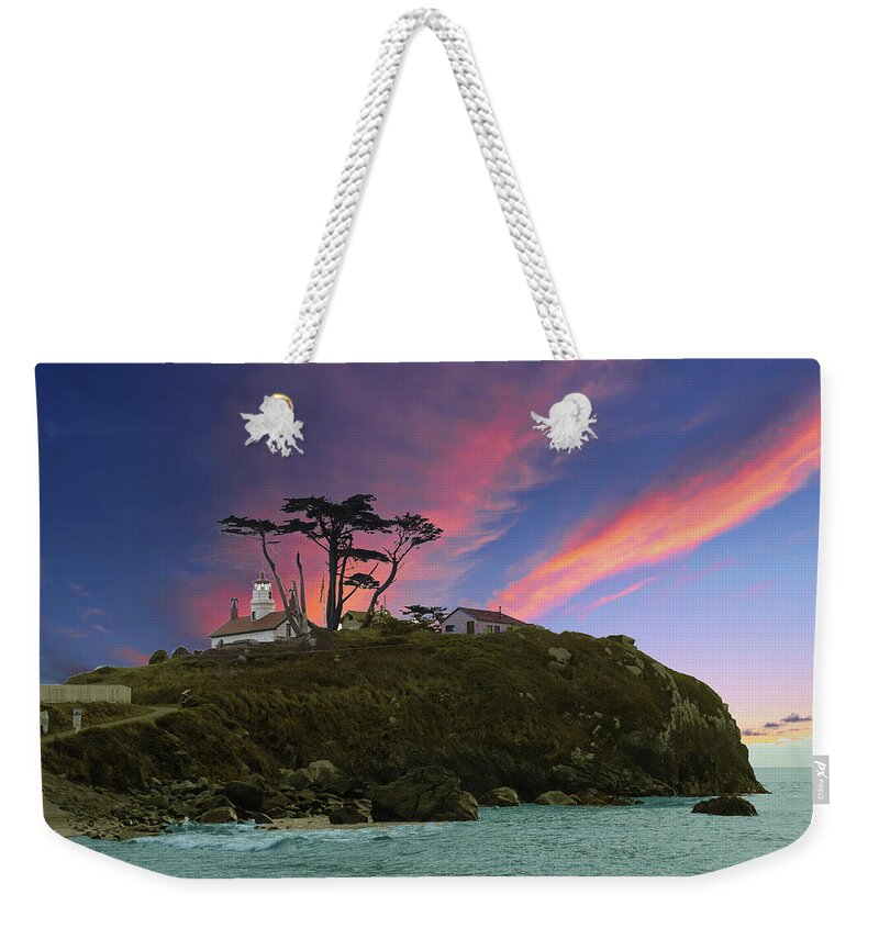 Battery Weekender Tote Bag featuring the photograph Battery Point Lighthouse at sunset by Steve Estvanik