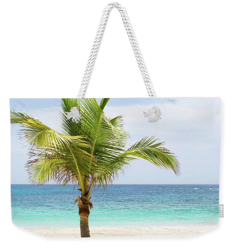 Scenics Weekender Tote Bag featuring the photograph Beach Scene With Palm Tree And Lounge by Sangfoto