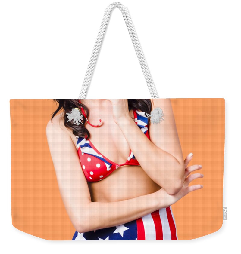 Pinup Weekender Tote Bag featuring the photograph Beautiful american military pin up girl by Jorgo Photography