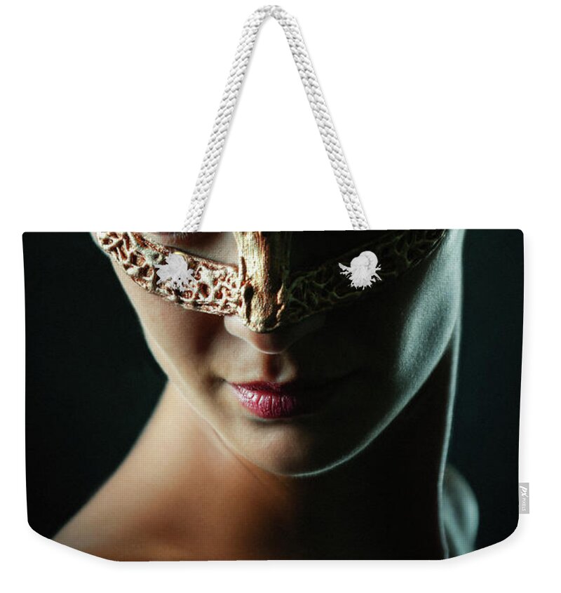 Art Weekender Tote Bag featuring the photograph Beauty model woman wearing masquerade carnival mask by Dimitar Hristov
