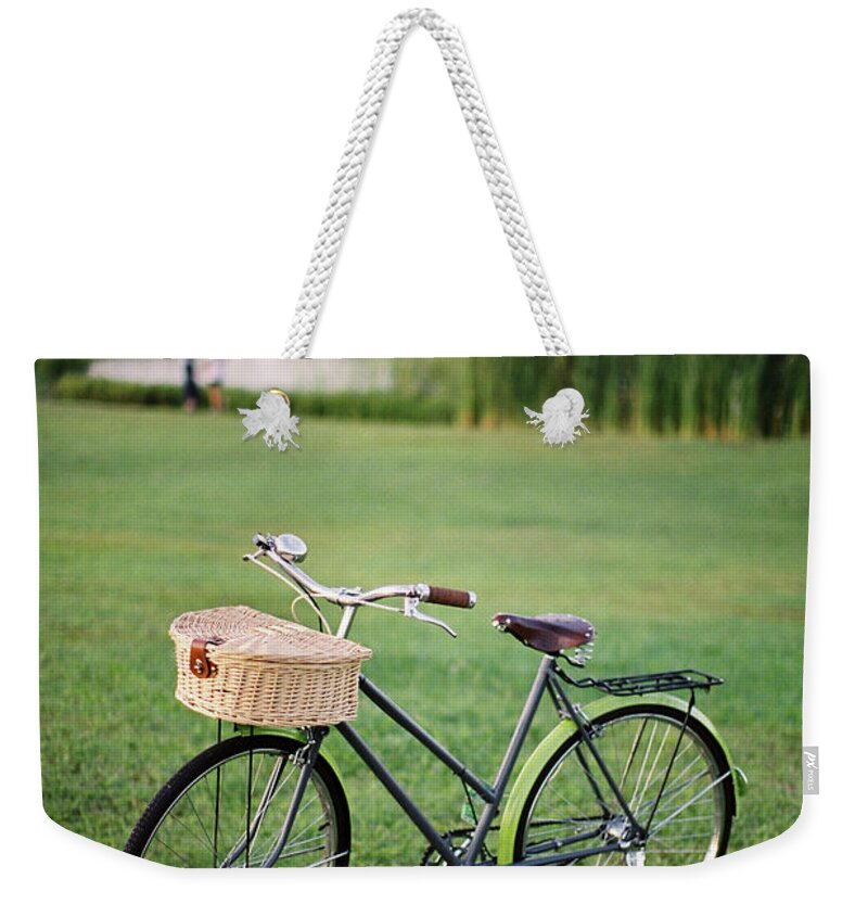 Grass Weekender Tote Bag featuring the photograph Bicycle At The Park by Genkigenki