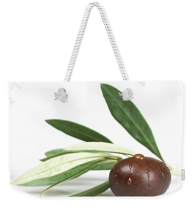 White Background Weekender Tote Bag featuring the photograph Black Olive With Leaves by Imagestock
