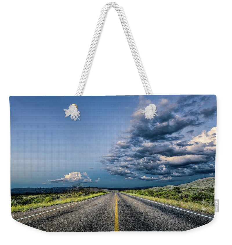 Big Bend Weekender Tote Bag featuring the photograph Blue Highway by David Downs