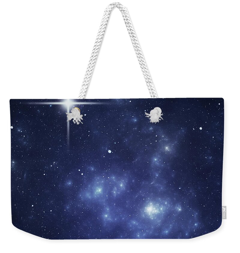 Black Color Weekender Tote Bag featuring the photograph Blue Night Sky With A Bright Star In by Sololos