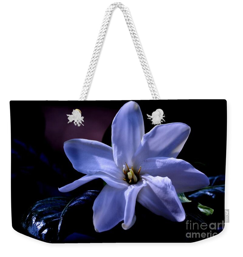 Flower Weekender Tote Bag featuring the photograph Blue Spell by Lorenzo Cassina