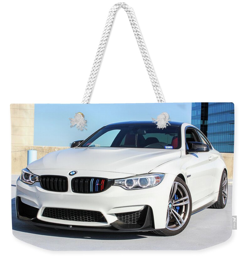 Bmw M4 Weekender Tote Bag featuring the photograph Bmw M4 by Rocco Silvestri