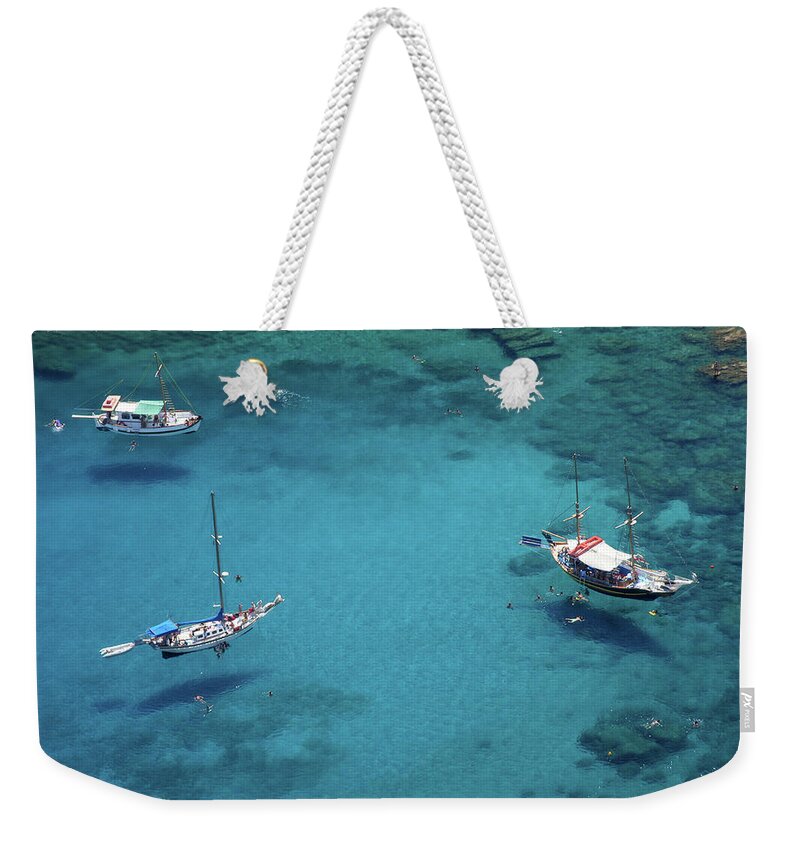 Underwater Weekender Tote Bag featuring the photograph Boats And Swimmers Seem To Be Flying by Michaelutech