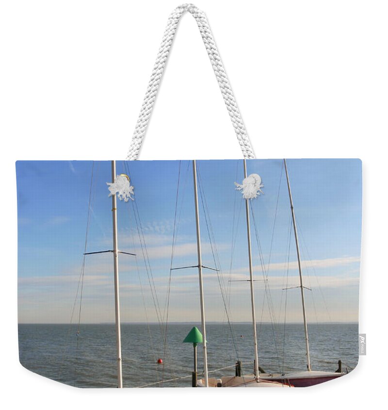 Tranquility Weekender Tote Bag featuring the photograph Boats At Sea by M D Baker