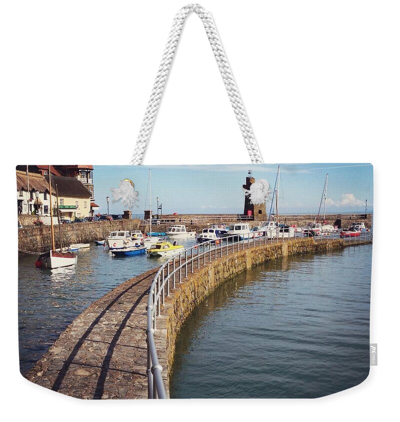Tranquility Weekender Tote Bag featuring the photograph Boats Moored In Quiet Harbour Of Small by Jodie Griggs