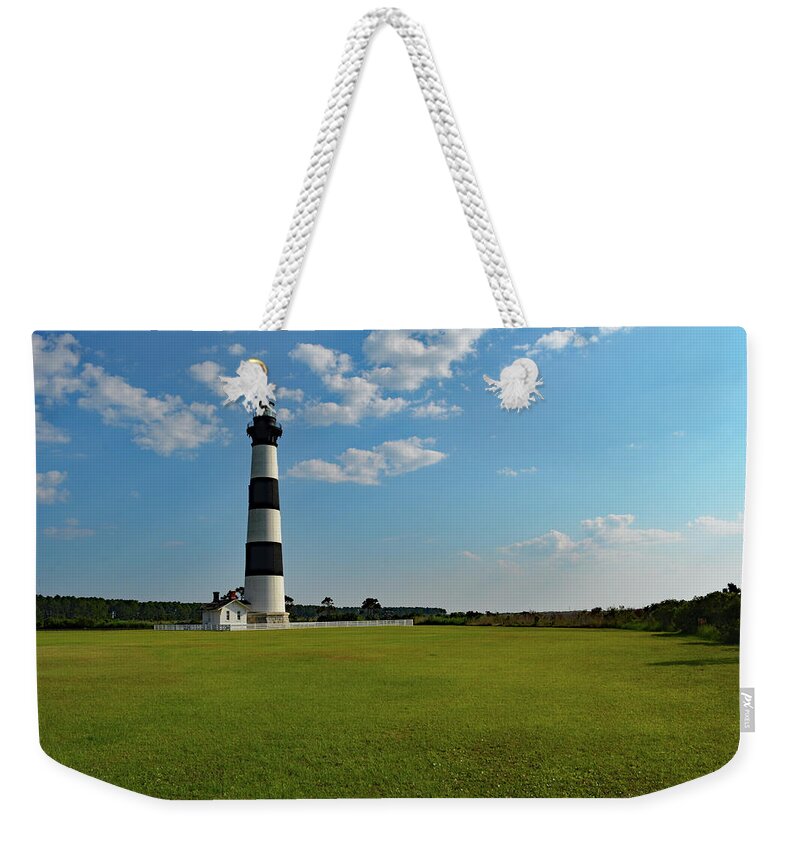 Bodie Island Lighthouse Weekender Tote Bag featuring the photograph Bodie Island Lighthouse Under the Clouds by Jimmie Bartlett